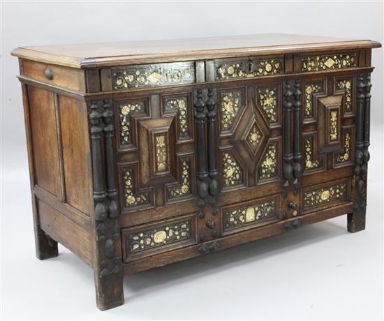 A 17th century style inlaid oak mule chest, W.4ft 6in. D.2ft 2in. H.2ft 10in.